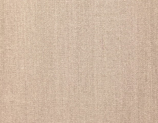 Textured background of beige natural textile   