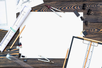 Architectural plans, pencil and ruler on the table. Place for your text
