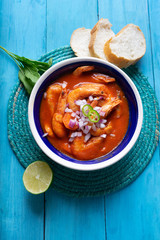 Mexican shrimp soup on blue background