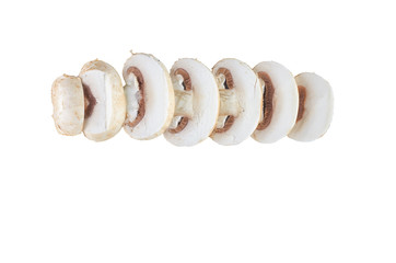 Fresh sliced champignons isolated on white background. The view from the top. Background of organic food.