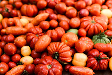 Fresh red tomatoes on table