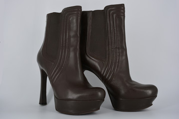 Brown women's stylish autumn boots made of genuine leather with high and thin heels.