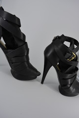 Sexy glamorous black women's sandals from genuine cowhide matte leather on high heels. Fashion...