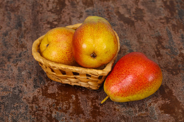 Pear heap in the wooden basket