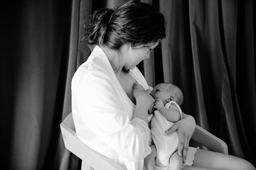 young woman breastfeeding her infant child