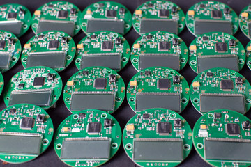 round electronic boards with display, microchip and processor, many meter components