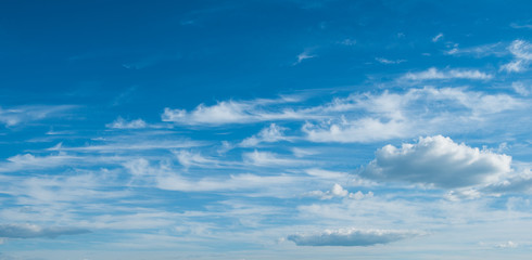Naklejka na ściany i meble Deep blue sky background with beautiful white clouds