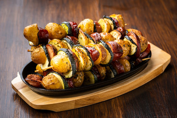 Potato skewers with sausage and zucchini