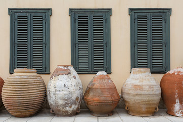 Ceramic vessels in front of the building in Athens.
