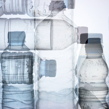 Used water bottles and white background
