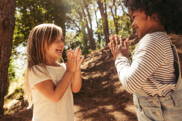 Cute girls playing patty cake