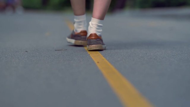 Man in casual shoes and socks walking away