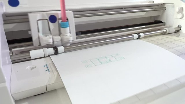 A drawing plotter draws a schematic of industrial details. Device design