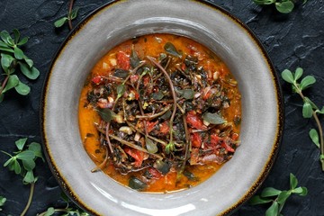 dish of purslane. potulak-edible useful weed. stalks of purslane stewed with tomatoes. Turkish, Greek, Mexican cuisine. eat the weeds, wild food. Omega-3