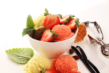 Set of ice cream scoops of different colors and flavours with berries and fruits