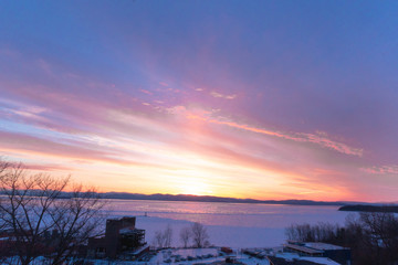 sunset over frozen lake