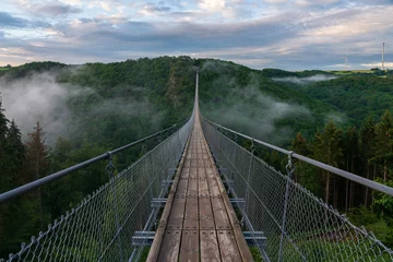 Fototapeten View of a suspension bridge in Germany, Geierlay. © Bernhard