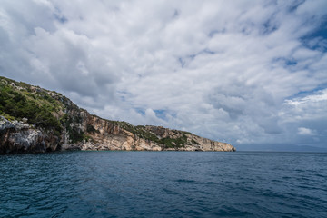 Fototapeta na wymiar Coastline cliffs near Blue Caves