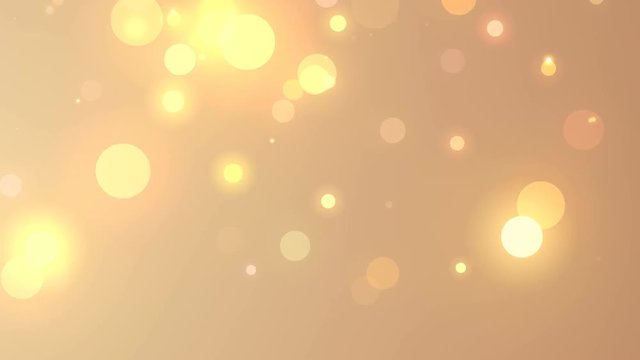 Abstract Golden Christmas motion background. Gold sparkles and round glitter bokeh particles and light. New year collection