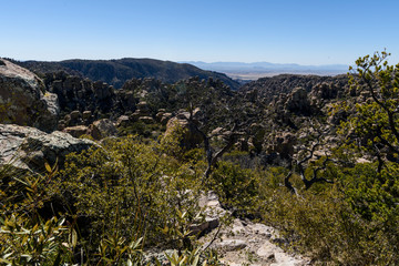 Hoodoos and Rock formations afford views of the valley below from the mountains of the Chiricahua National Monument in Southeastern Arizona.