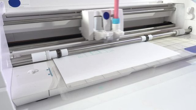 A drawing plotter draws a schematic of industrial details. Device design