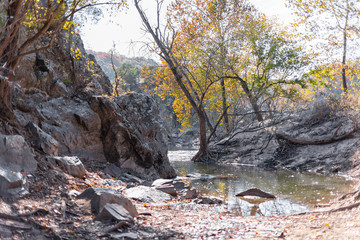 View on Potomac river with mountain cliff rocks in Great Falls park in autumn of Maryland with...