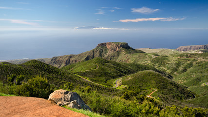 Fototapeta na wymiar View from Garajonay towards La Fortaleza with La Palma in the background, Garajonay National Park, La Gomera, Spain