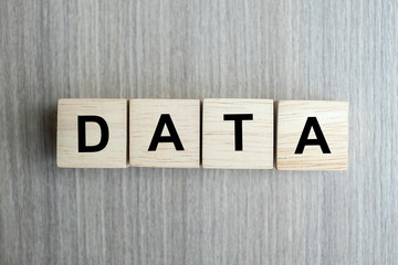 DATA business word conceptual with wooden cubes block on table background