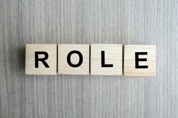 ROLE business word conceptual with wooden cubes block on table background