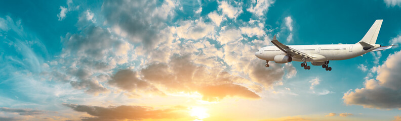 Airplane in the sky at sunrise