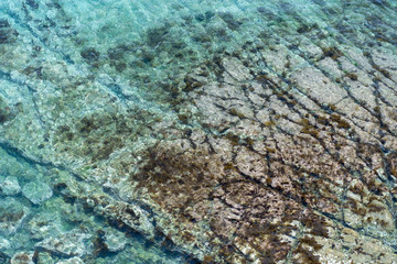 sea picture with clear water with bottom traces