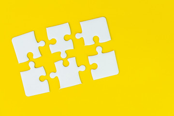 6 jigsaw puzzle on solid yellow background using as six important thing, solutions combine or working together to success or solve problem