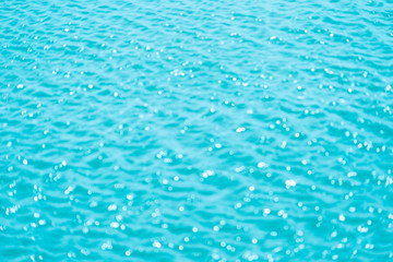 Abstract bokeh from light in the blue water