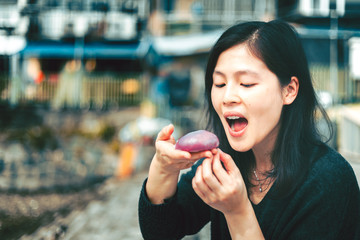 Woman eating traditional chinese sweet sticky rice cake