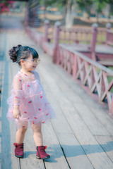 portrait of a girl. Happy little girl in autumn park. Fashion Kid outdoor.