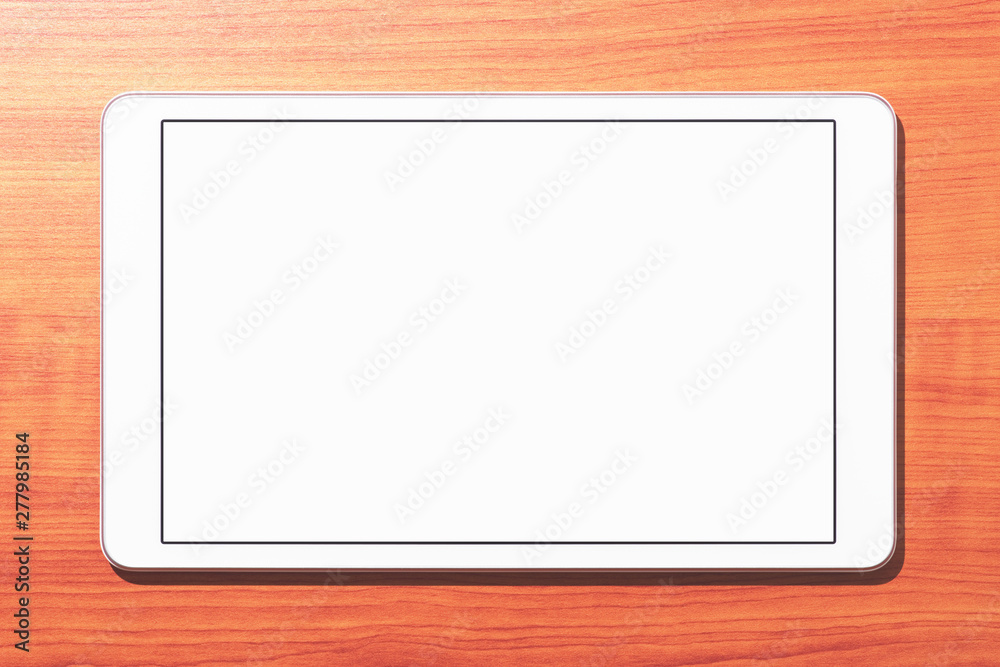Poster closeup of white tablet computer on wooden table. blank screen. top view.