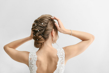 Naklejka premium Beautiful young bride on white background