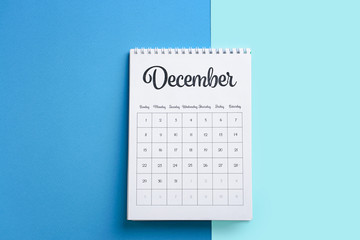 Flip paper calendar on color background