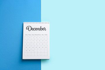 Flip paper calendar on color background