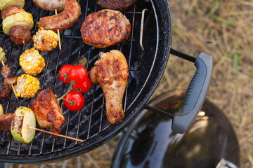 Cooking of tasty food on barbecue grill outdoors