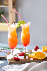 Glasses of tasty summer cocktail on table