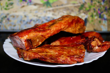 smoked pork ribs on a white platter