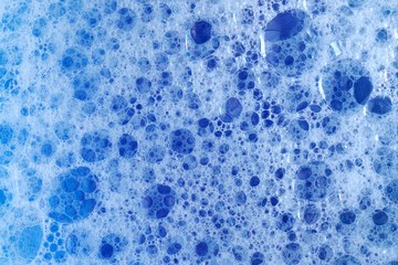 foam bubbles.blue soap bubbles background. Texture Foam .Foam Water Soap Suds Background.