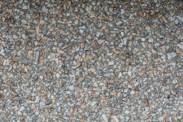 rough textured wall backdrop filled with tiny rocks