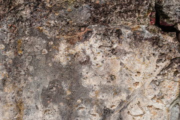 Texture of a concrete wall with cracks and scratches which can be used as a background