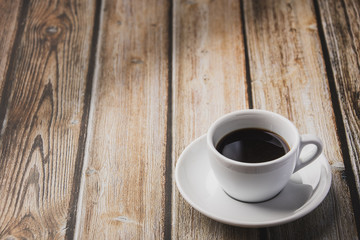 cup of coffee on wooden table