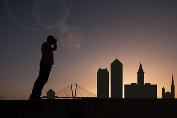 Traveler in front of city skyline of cleveland in united states