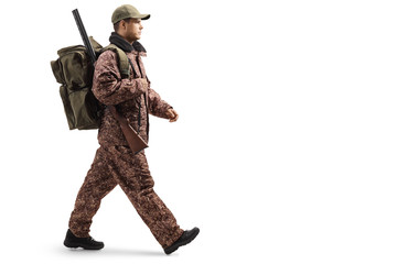 Hunter in a camouflage uniform walking