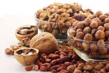 Different nuts in glass cups