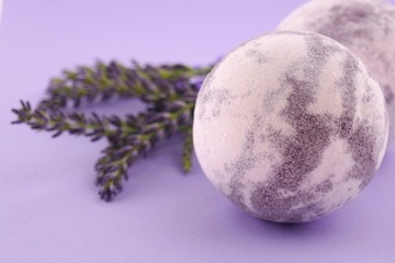 Lavender Bath Bomb.  striped  bath bombs set and sprigs of lavender close-up on a lilac background.Organic body cosmetics	